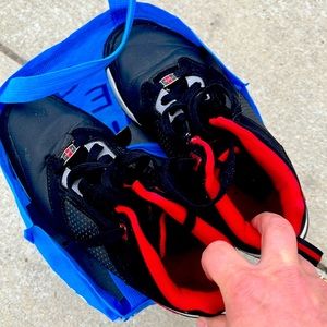 Pair of 8.5 fubu’s red black and white athletic shoes